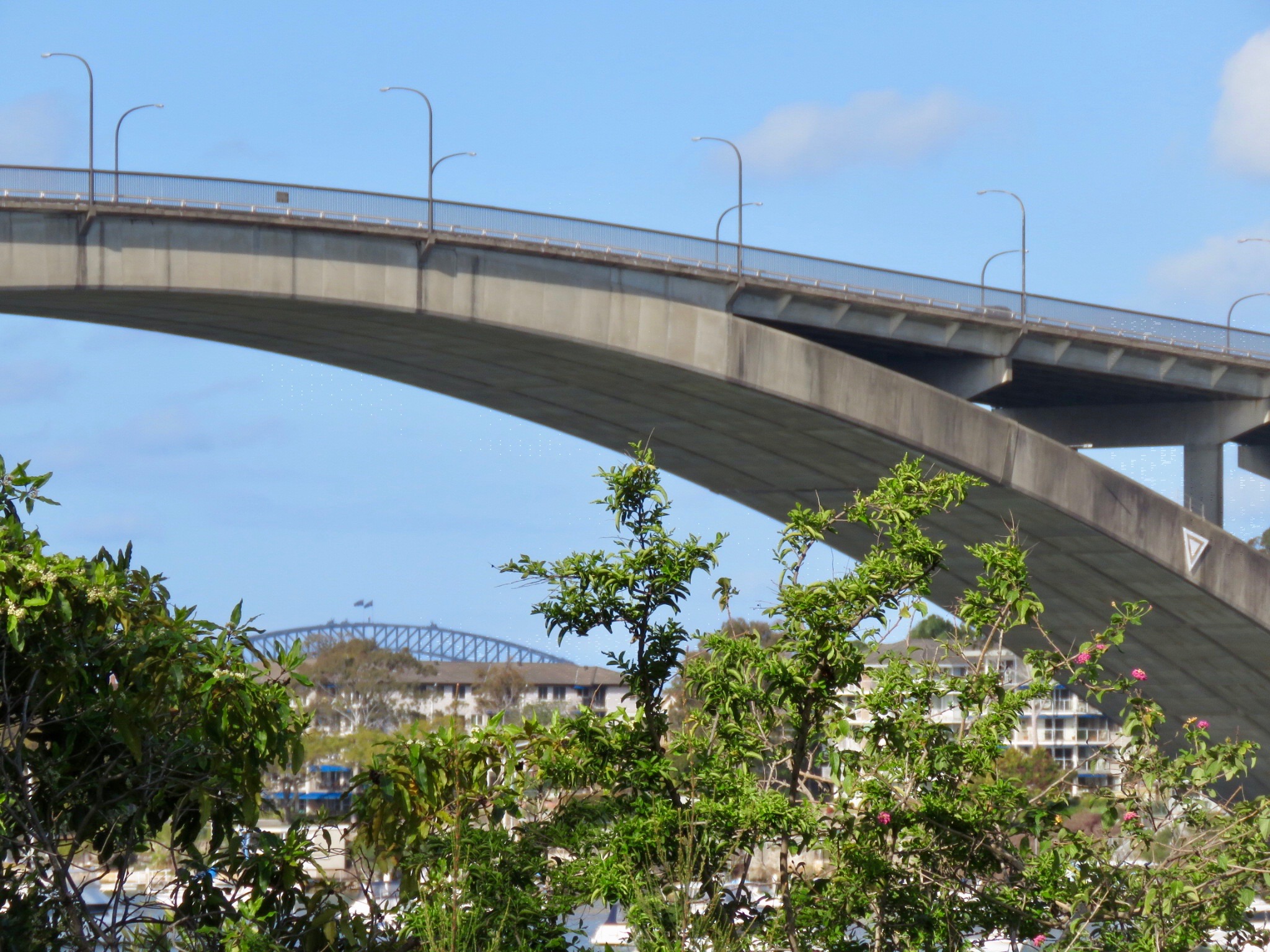 Gladesville Bridge arch with Sydney Harbour Bridge in background