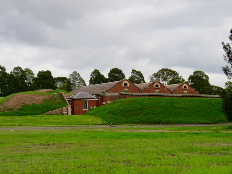 Armory buildings behind an embankment